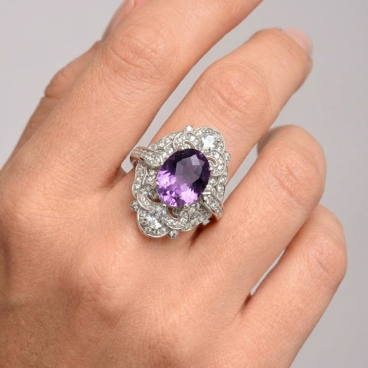 Amethyst diamond statement ring worn on hand close-up