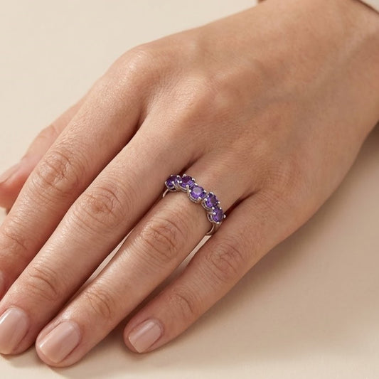Model wearing a sterling silver amethyst five stone ring on hand