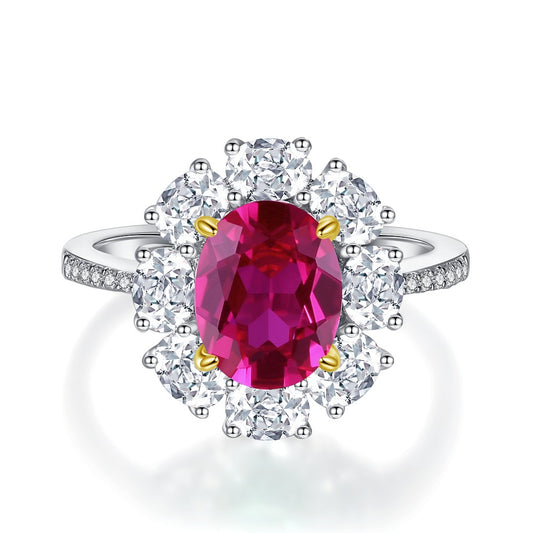 Ruby Oval Halo Ring on white background
