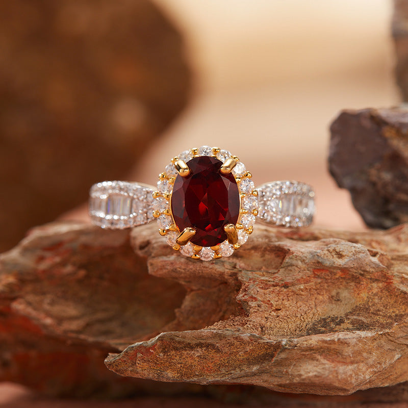 Luxury garnet ring displayed on natural stone background