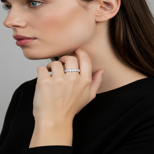 Model wearing Aeterna Jewelry oval-cut eternity ring, highlighting refined brilliance and timeless elegance