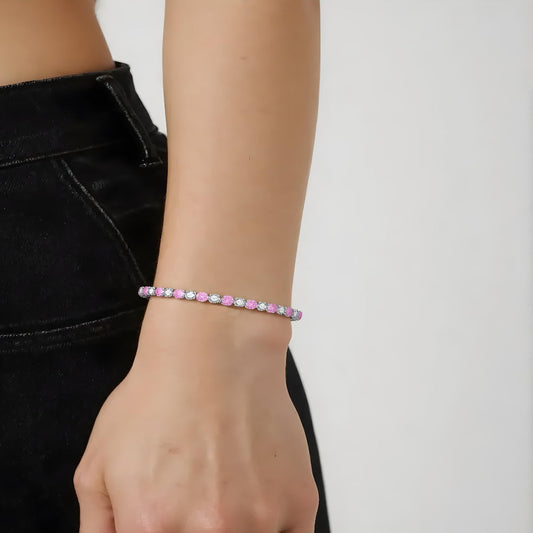Model wearing pink and white tennis bracelet by Aeterna Jewelry