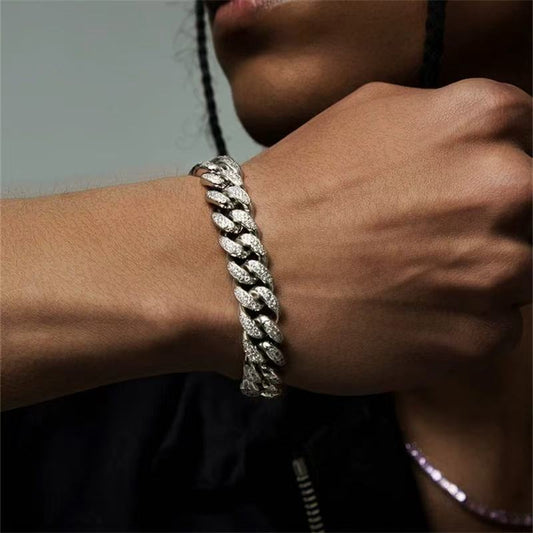 Model wearing silver cuban link bracelet by Aeterna Jewelry close-up