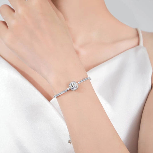 Model wearing halo adjustable bracelet by Aeterna Jewelry in white dress