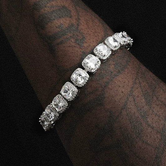 Man wearing silver cushion halo bracelet by Aeterna Jewelry under soft lighting