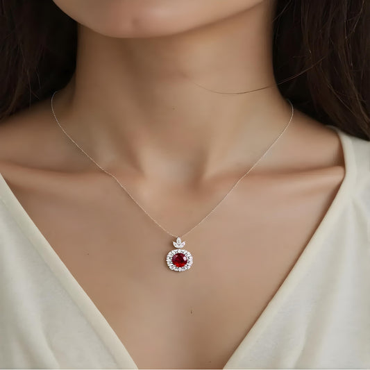 Aeterna Jewelry red ruby halo pendant necklace worn on model’s neckline