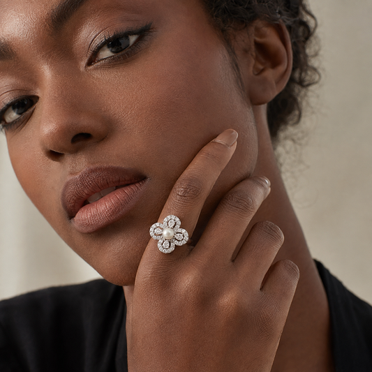 Aurelia Pearl Clover Statement Ring worn by a model with her hand resting against her face