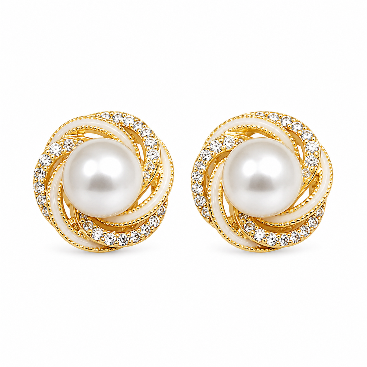 Close-up view of gold pearl stud earrings on white background