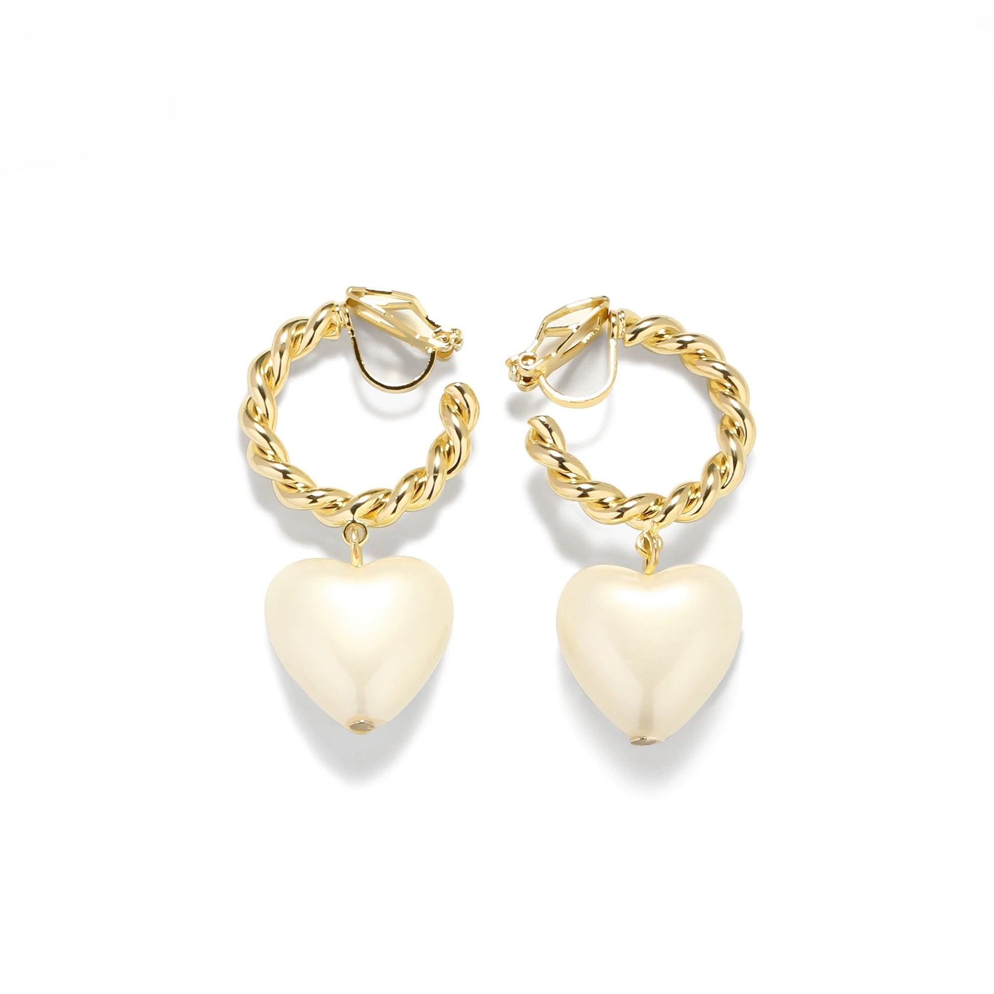 Gold twisted hoop earrings with heart-shaped pearl drops on a light grey background