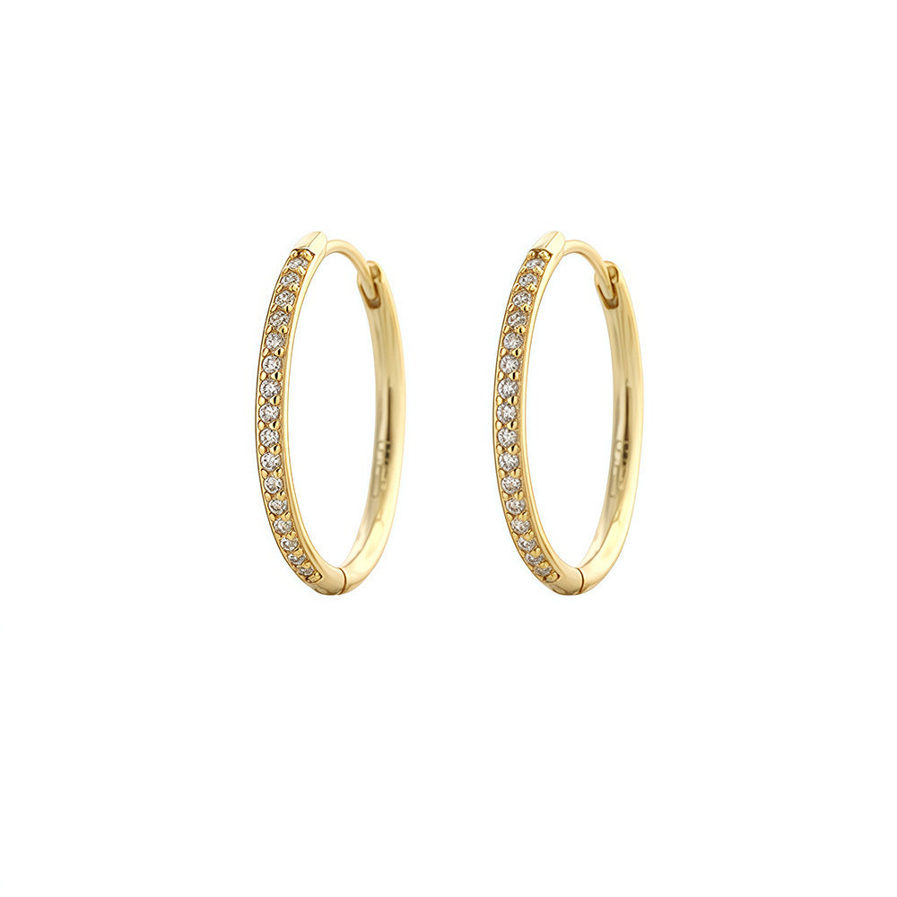 Pair of gold-plated 16mm pavé hoop earrings on a white background