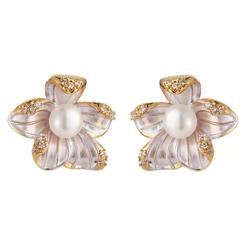 Gold-plated silver pearl blossom stud earrings on a white background