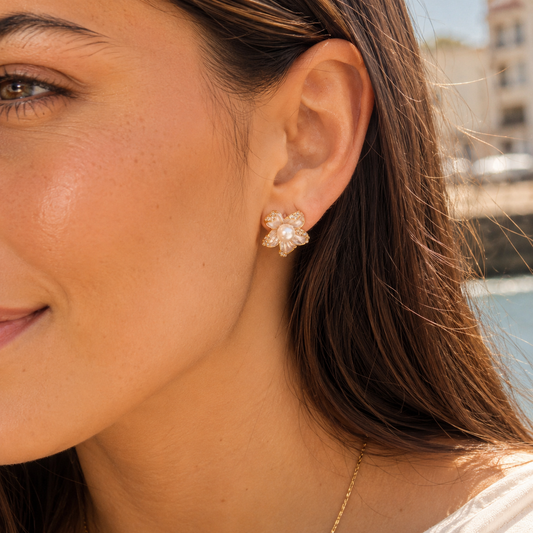 Close-up of model wearing Elowen Pearl Blossom Stud Earrings outdoors