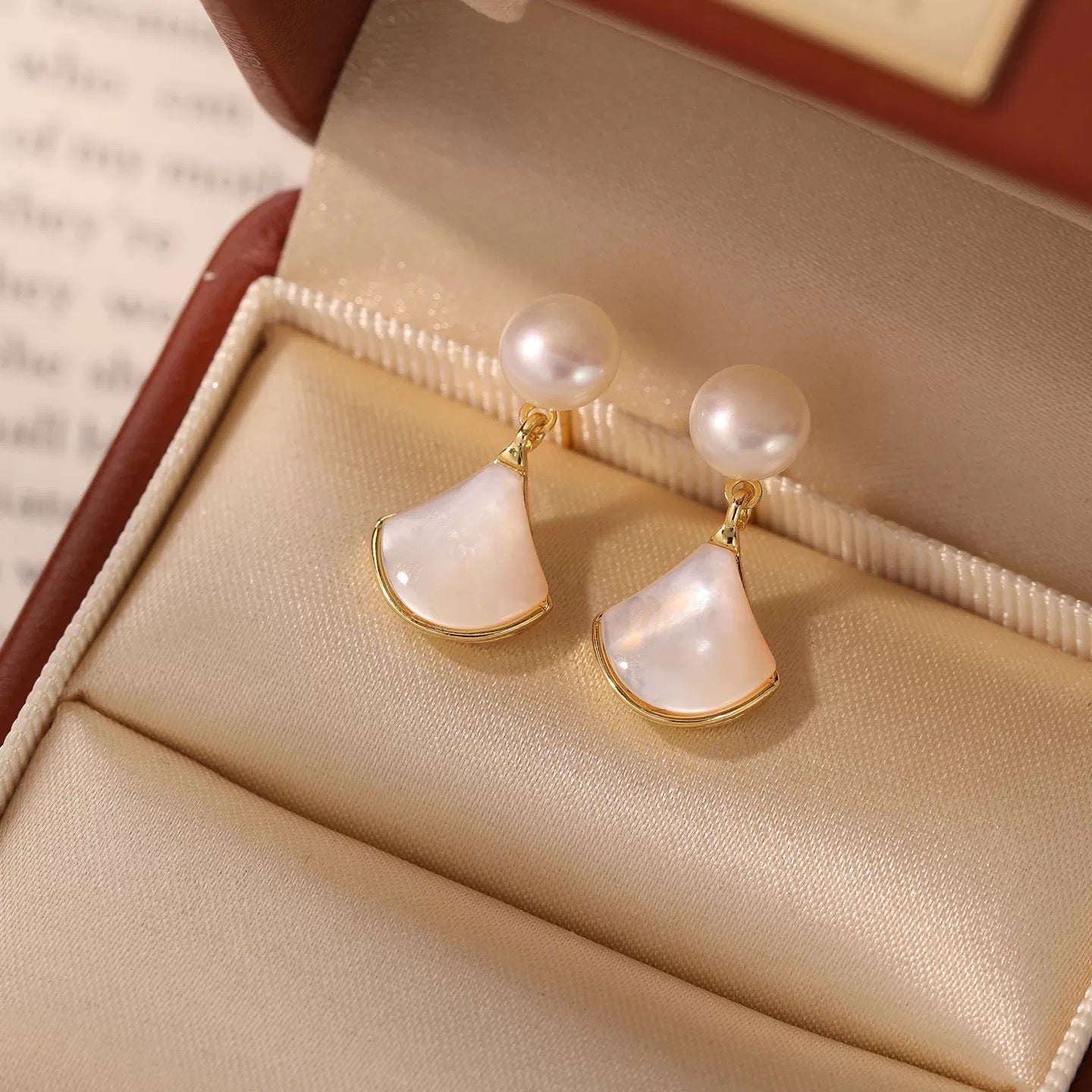 Pearl Fan Drop Earrings displayed in a jewellery box