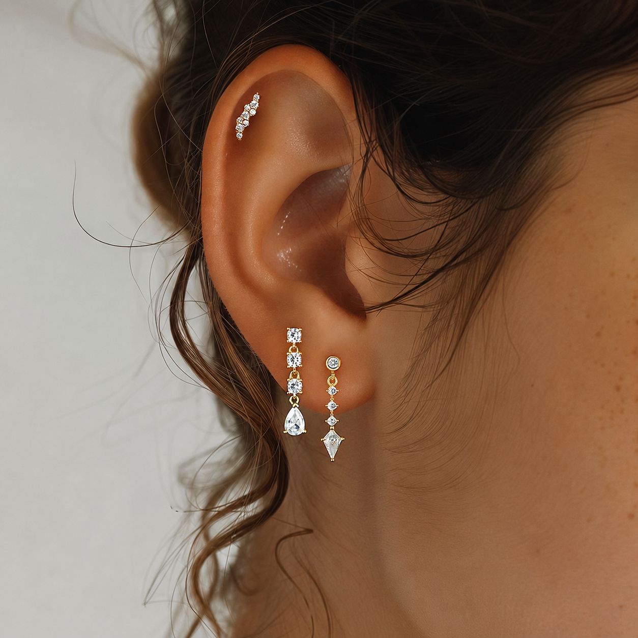 Model wearing mixed-cut cubic zirconia drop earrings
