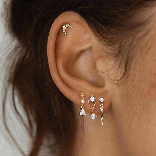 Model wearing a mixed cubic zirconia drop earring stack