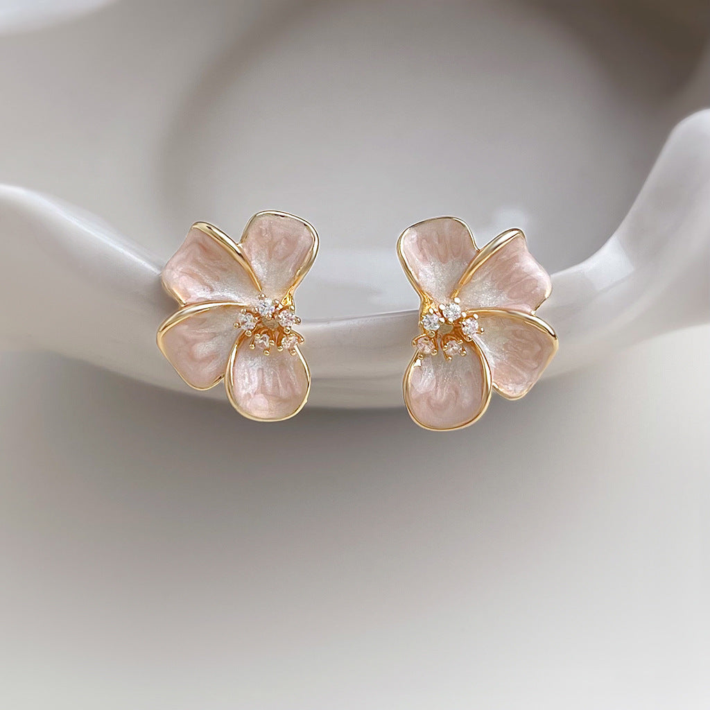 Front view of Rosalie Pink Blossom Stud Earrings with gold-tone outlines and clear floral centre accents