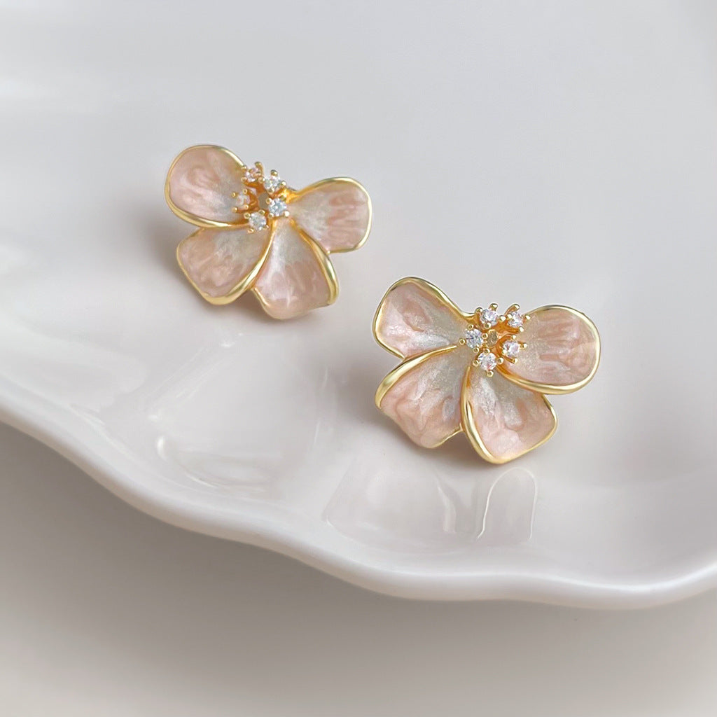 Rosalie Pink Blossom Stud Earrings showing blush-pink pearlescent petals and clear centre accents