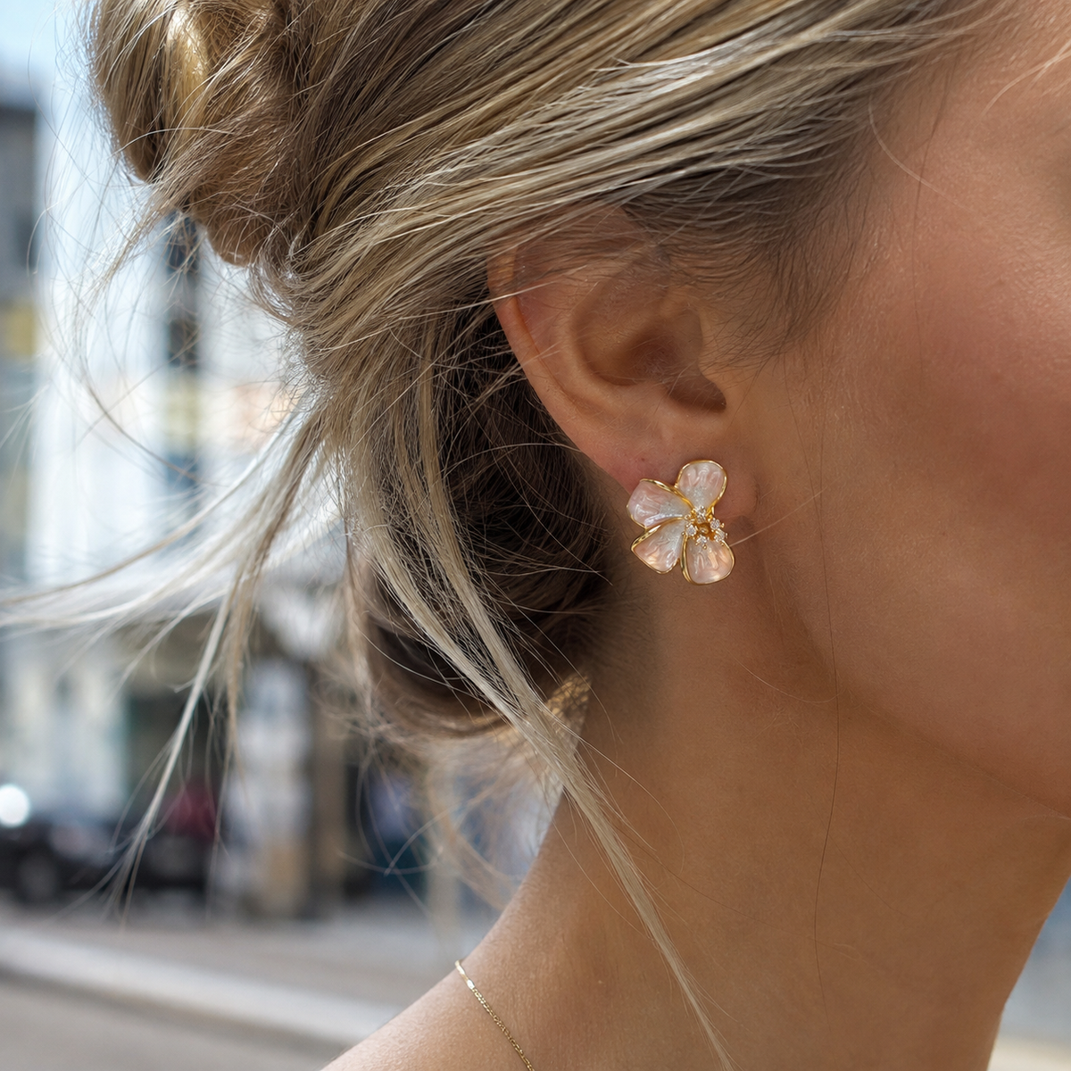 Rosalie Pink Blossom Stud Earrings worn on a blonde model in natural outdoor light