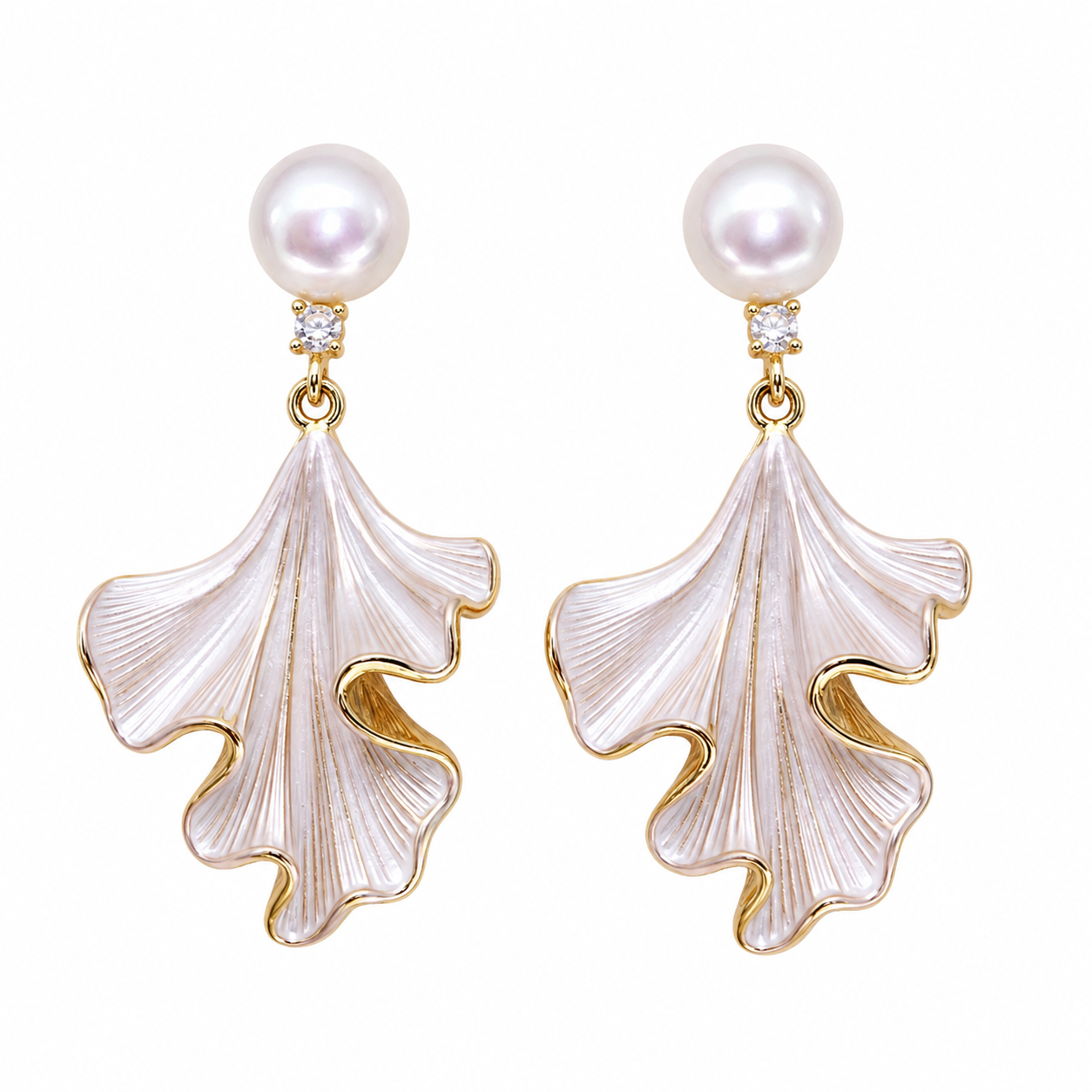Pair of Liora Pearl Ginkgo Drop Earrings with freshwater pearls and sculpted gold-edged pendants on a white background