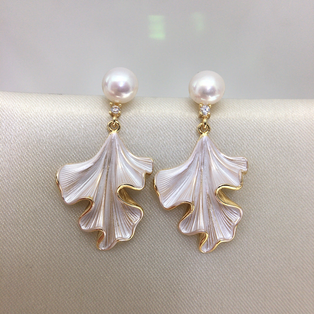 Pair of Liora Pearl Ginkgo Drop Earrings with round freshwater pearls and finely ridged ginkgo-inspired pendants
