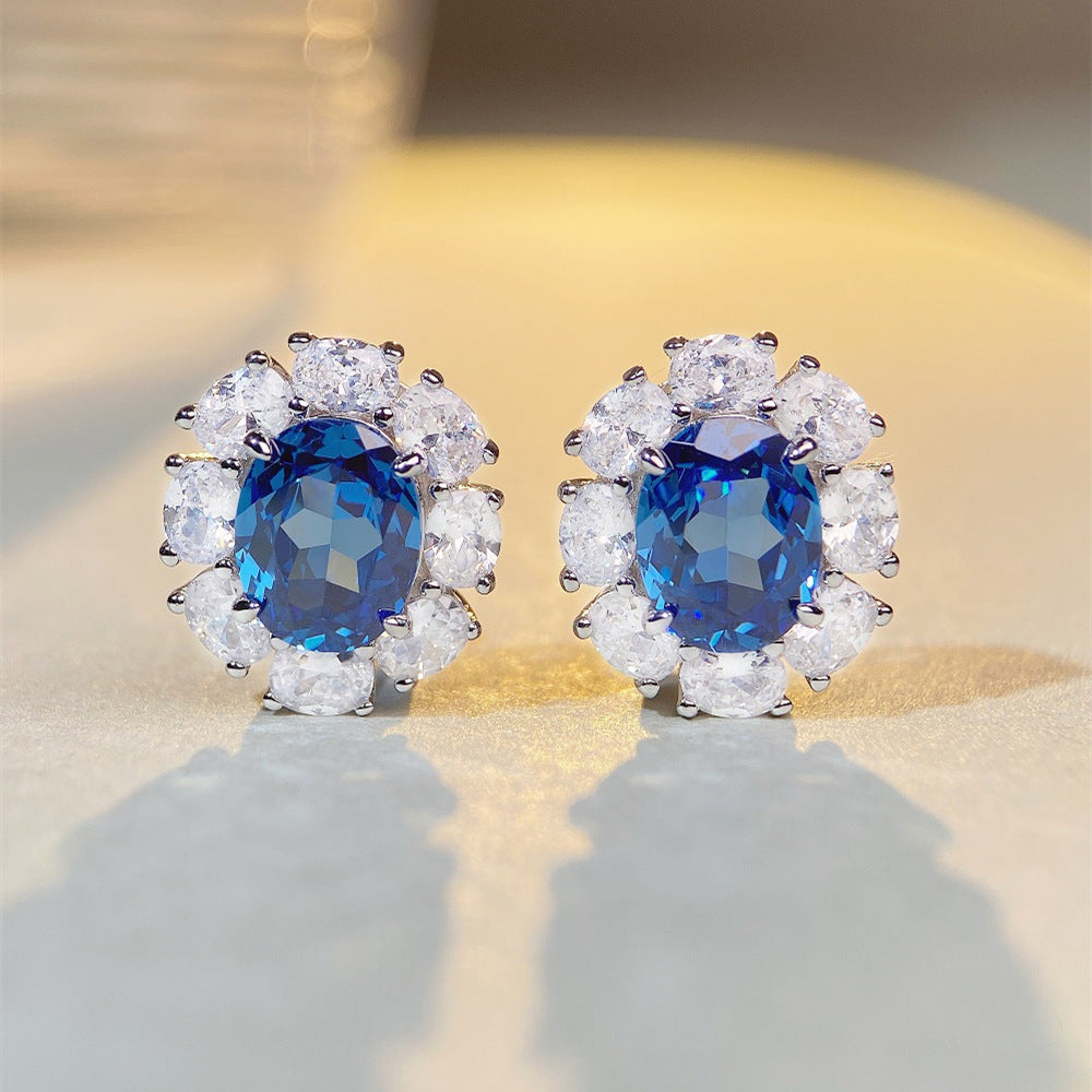 Oval blue sapphire and diamond halo stud earrings in sterling silver ¨C Aeterna Jewellery UK