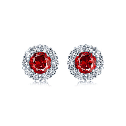 Elegant ruby and diamond halo stud earrings in sterling silver, fine jewelry by Aeterna Jewelry, product photography on white background