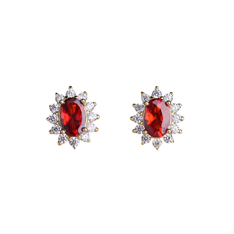 Gold plated sterling silver garnet halo stud earrings with oval red birthstone