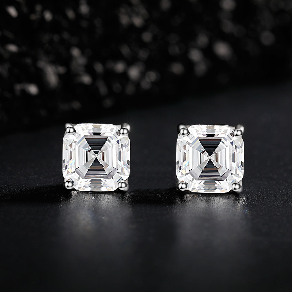 Asscher cut diamond stud earrings in sterling silver, fine minimalist jewelry by Aeterna Jewelry, luxury close-up on dark reflective background