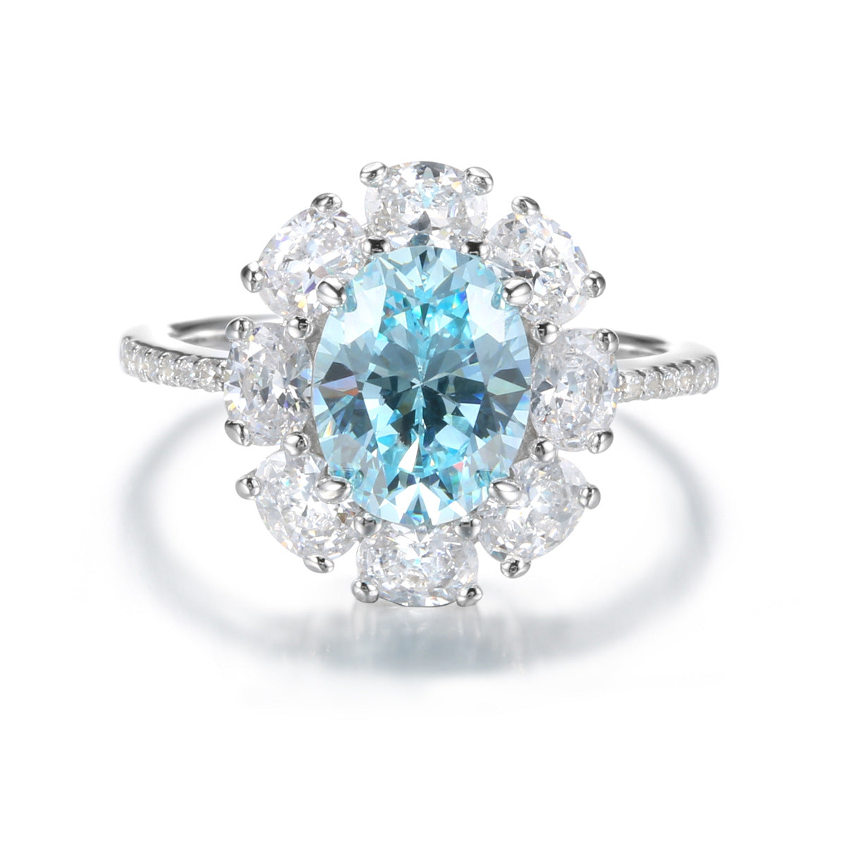 Aeterna Jewelry oval aquamarine flower halo ring with round white stones on white background