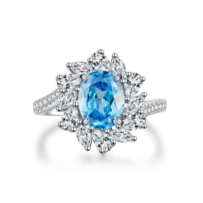 Aeterna Jewelry oval aquamarine flower halo ring with white marquise stones on white background