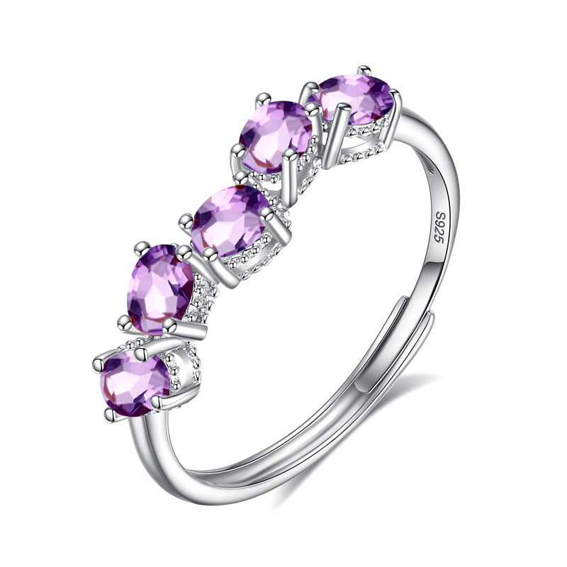 Sterling silver five stone amethyst ring on white background