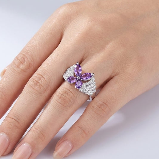 Amethyst butterfly ring worn on hand in sterling silver