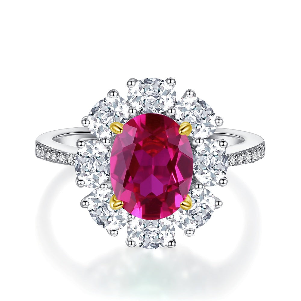Aeterna Jewelry oval ruby flower halo ring with white round stones on white background
