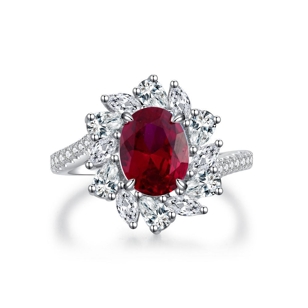 Aeterna Jewelry oval ruby halo flower ring with marquise white stones on white