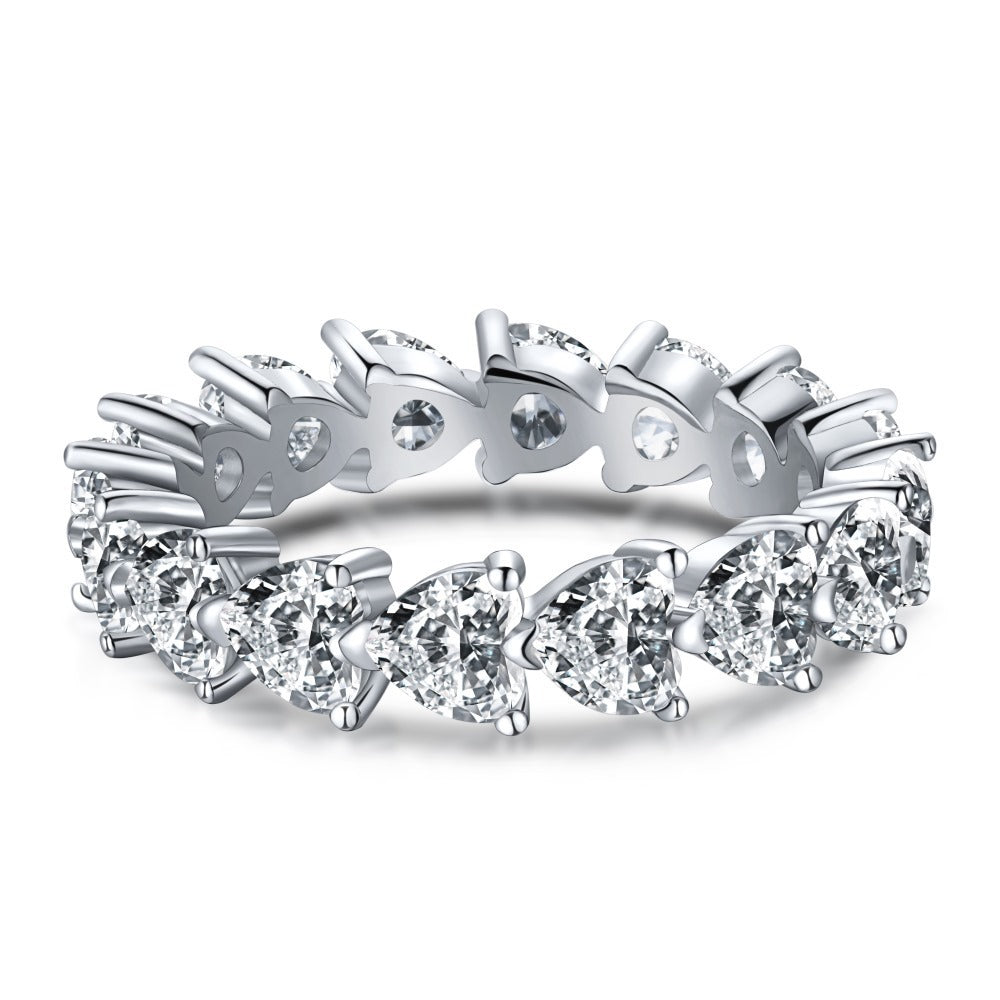 Aeterna Jewelry triangle-cut full eternity ring in sterling silver with white gemstones on white background