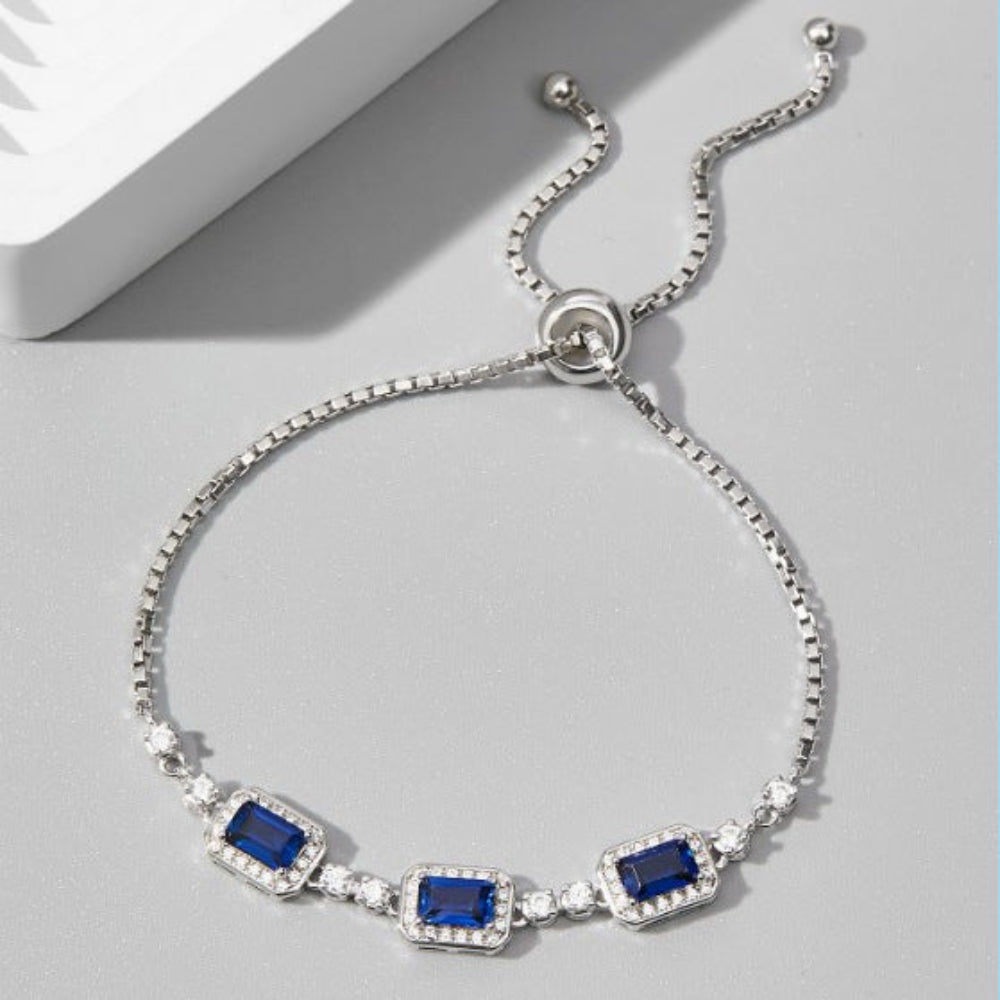 Aeterna Jewelry sapphire trio adjustable bracelet on light gray background