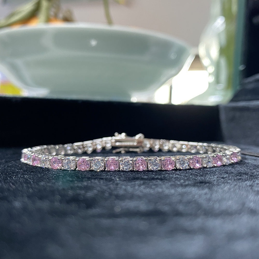 Aeterna Jewelry pink and white gradient tennis bracelet on black velvet background