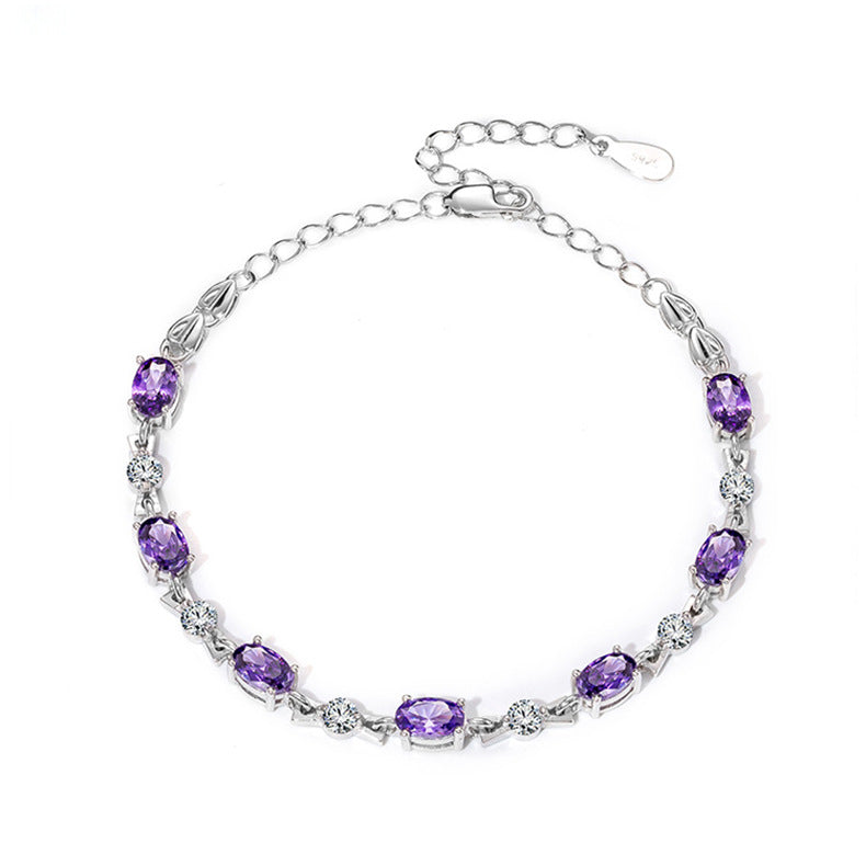 Silver amethyst bracelet with oval gemstones on white background