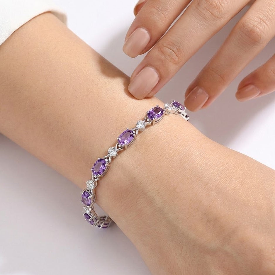 Amethyst bracelet worn on wrist with silver setting and diamond accents