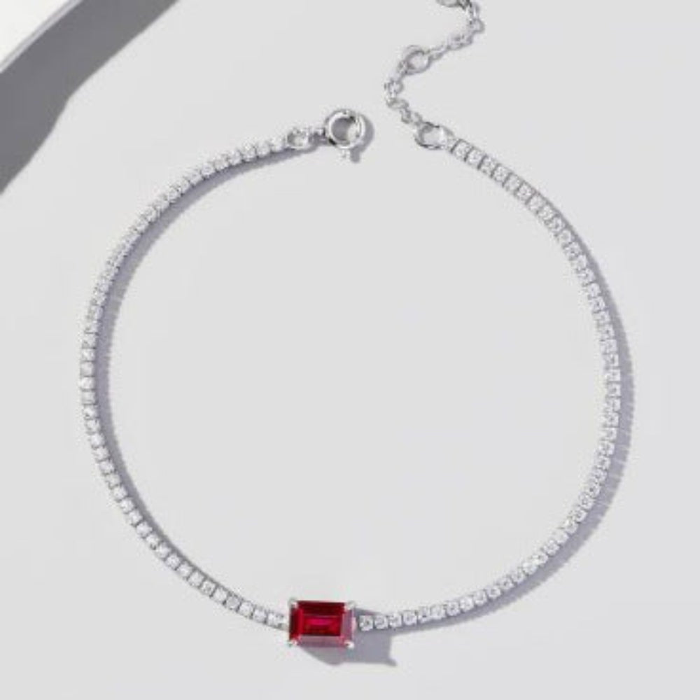 Aeterna Jewelry ruby solitaire tennis bracelet on white background