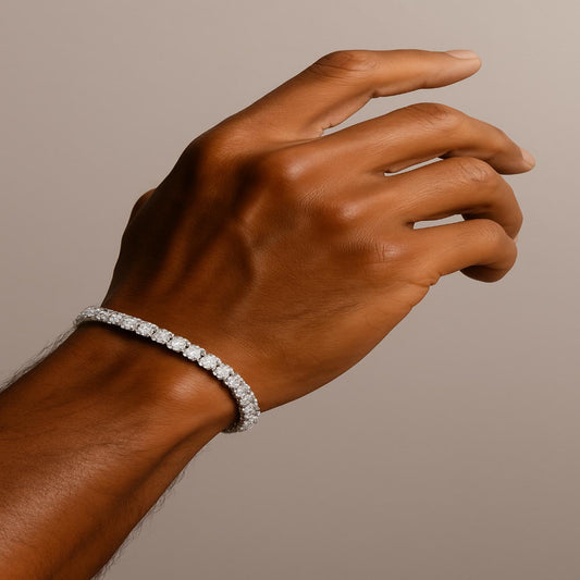 Sterling silver tennis bracelet with round-cut simulated diamonds worn on a medium brown hand, close-up luxury jewelry photo with elegant lighting.