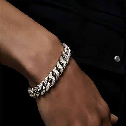 Stylish man wearing silver cuban link bracelet with black outfit