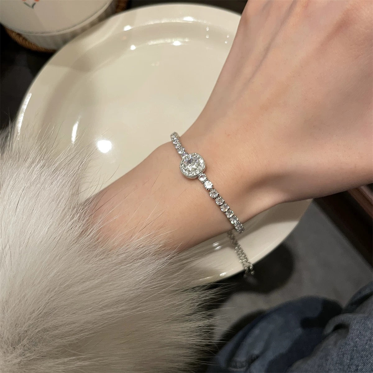 Halo adjustable bracelet photographed in soft lighting for evening wear styling