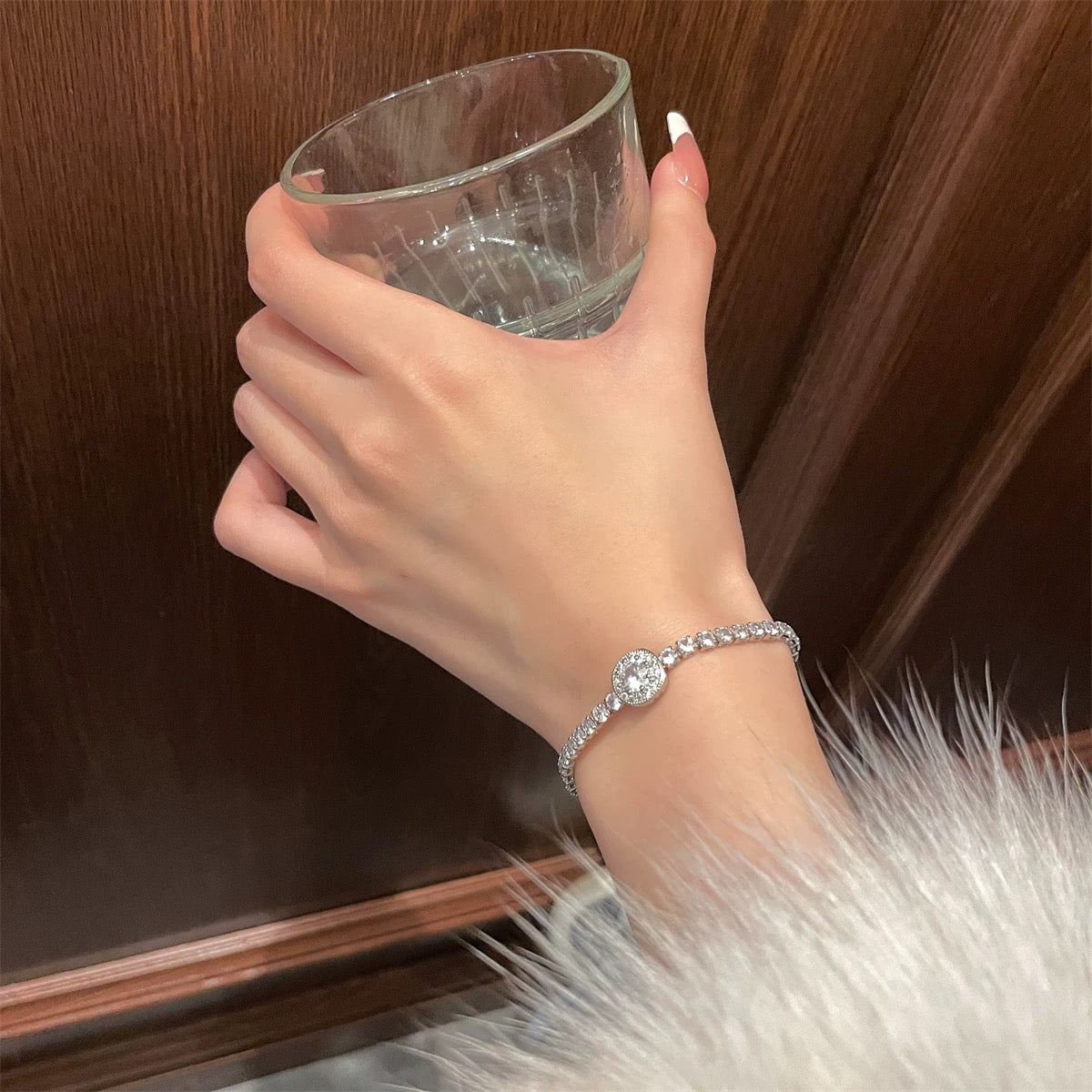 Aeterna Jewelry halo bracelet worn with fur coat, highlighting timeless luxury