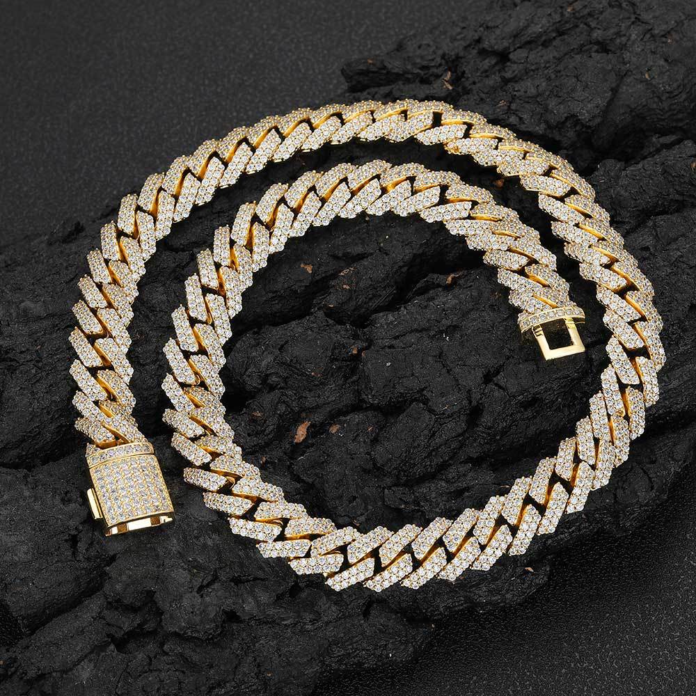 Aeterna Jewelry gold iced-out Cuban chain displayed on black stone surface