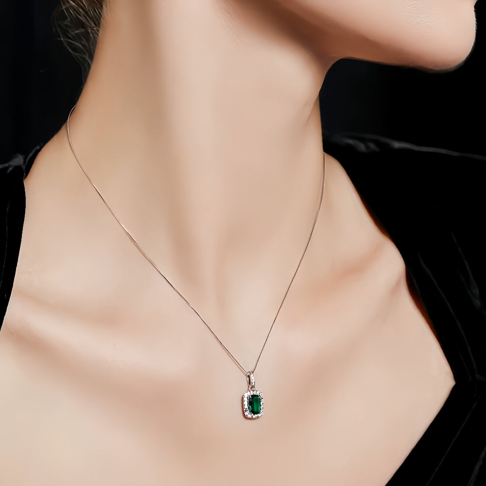 Aeterna Jewelry emerald halo pendant necklace worn on model¡¯s neckline
